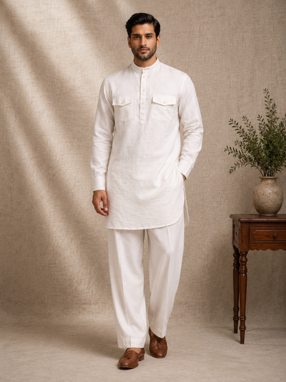 Man wearing off white linen pathani kurta set with dual chest pockets and salwar pants mandarin collar premium ethnic co-ord Ethnoir